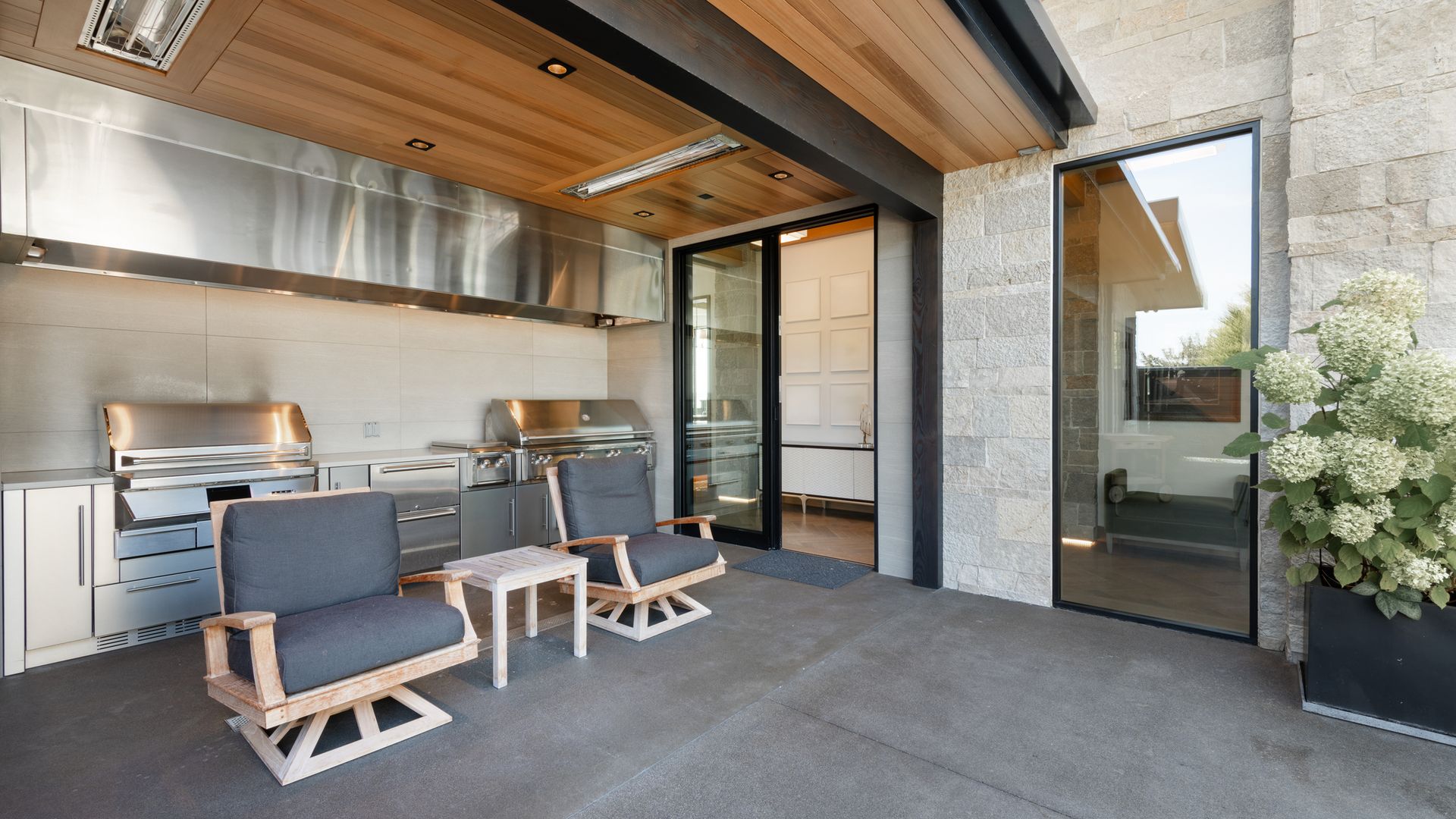 Covered alfresco area with a stainless steel outdoor BBQ kitchen
